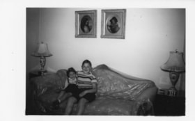 Beverly Allice and Murray Allice sitting on a couch