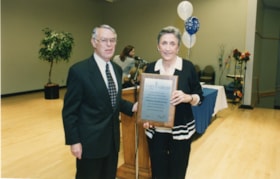 Miriam Weiner receives a plaque for the Bertraum L. Katz Memorial Fund from President Norman Lesh.