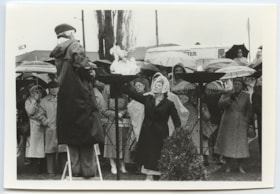 Unidentified woman lighting a flare at Holocaust Memorial