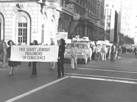 Soviet Jewry Montreal march and demonstration, including marchers walking past the Kon Tiki restaurant in the Mount Royal Hotel. Speaker at demonstration: Rabbi S. SHOHAM