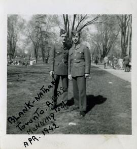 Exterior snapshot of two Royal Canadian Air Force personnel, Manning Pool, Toronto. Includes Nathan Benditsky.