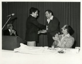 Ken Radnoff, left, presenting Irving Rivers with a plaque for his leadership and dedication in making the Jewish Community Centre.