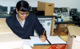 Robyn Butcher working in the Ottawa Jewish Archives.