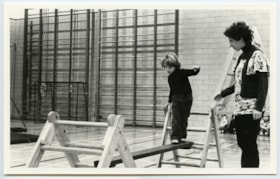 Hillel Academy student walking a balance beam during gym class.