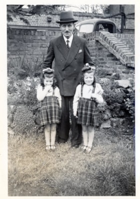 Portrait of Twin Girls with Man - Naomi and Sister