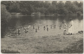 Children swimming in a river