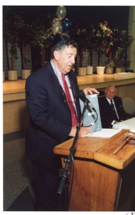 Unidentified man giving a speech at an Ottawa Jewish Community Foundation annual general meeting.