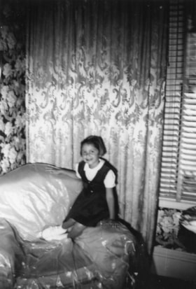 Beverly Allice sitting on a couch
