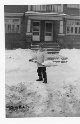 Murray Allice shoveling snow