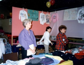 Esther Kwavnick, unidentified and Sharon Peebles working a booth at the Ottawa Hadassah-Wizo Bazaar.