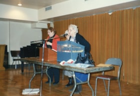 Three women speaking at a Golden Age Club event