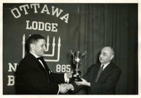 Robert Edelstein (right) presenting an award to Irving Rivers (left) from B'nai B'rith.