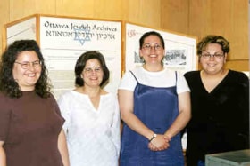 Paula Moon, Jacinda Bain, Jennifer Irons and Vanessa Sevc with their Ottawa Jewish Archives exhibit.