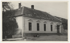 School building with children in front