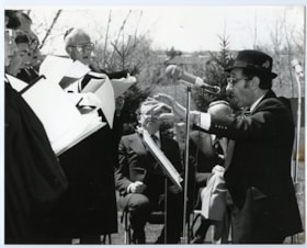 Cantor David Aptowitzer conducting a choir at Yom Hashoa, May 6 1979