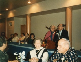Cantor Carmel leading a group in the Birkat HaMazon