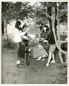 Group portrait of girls making tree ornament, Camp Wooden Acres, Montreal.