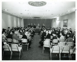 Group portrait of conferene room, inclusing spectators and speakers, Jewish Community Camps, Montreal.