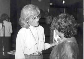 Freda Keet and an unidentified individual speaking at an Ottawa Hadassah Wizo Month event.