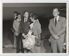 Prime Minister Pierre Elliott Trudeau stands with a group of people