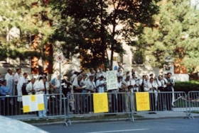 Men holding a minyan at a solidarity rally to protest the unfair imprisonment and convictions of 13 Iranian Jews.
