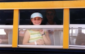 Girls looking out a school bus window (Soloway Jewish Community Centre of Ottawa camp).