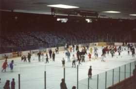 People skating on an indiir rink at Purim on Ice