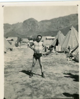 Unidentified man stands in camp in South Africa