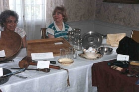 Gert Ages and Anita Rappaport watching the artifacts at the Billings Estate exhibit.