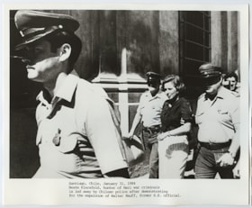 Nazi hunter Beate Klarsfeld being led away by Chilean Police