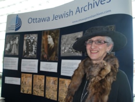 Anna Bilsky of the Ottawa Jewish Historical Society with exhibit about Lillian Bilsky Freiman at City Hall for Heritage Day.