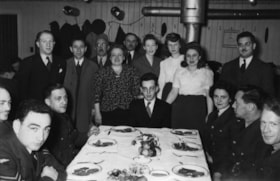 Servicemen World War II/Belleville, Ontario, dinner, possibly with refugees