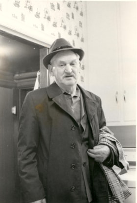 Laser Osterer standing in a doorway