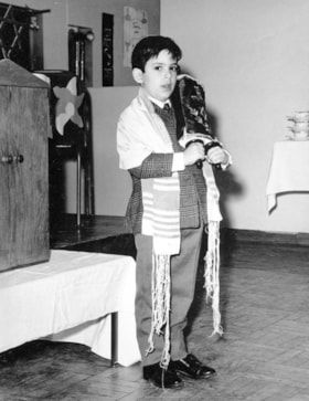 Hillel Academy student Mark Greenberg depicting Moses at a celebration to mark the beginning of Chumash study.