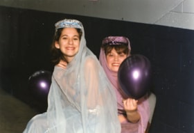 Two young girls in a princess costumes