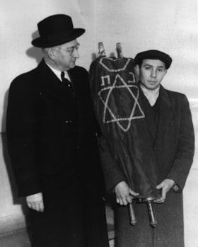 Torah donated by German Jews in Canada presentation to CJC officer Ben ROBINSON by one of the CJC-sponsored War Orphans