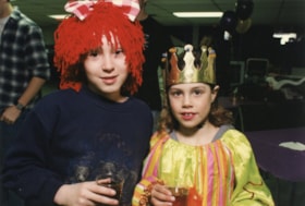 Two young kids in costumes