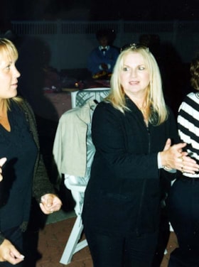 Jennifer Devries and unidentified woman at a staff BBQ.