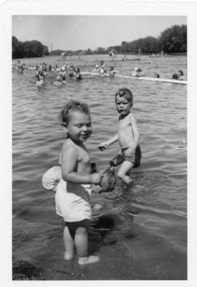 Two unidentified boys playing at the beach
