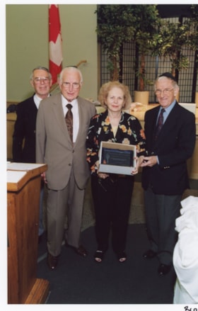 Norman Lesh with Edith Oko, (?) Shmit, and an unidentified man at an Ottawa Jewish Community Foundation annual general meeting.
