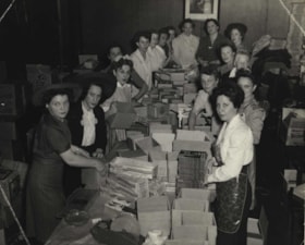 Servicemen, women packing comfort boxes