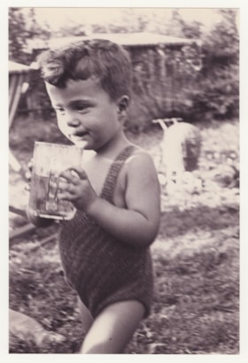 Milan Voticky drinking from a glass mug
