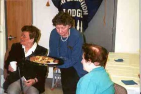 Dawn Logan serving treats to Inez Zelikovitz and Sylvia Kershman during the Ottawa Jewish Archives open house.for its donors and volunteers.
