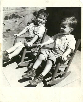 Group portrait of two young boys sitting in rocking chairs, Baron de Hirsch Institute group foster home, Montreal.