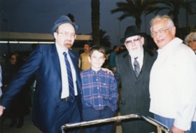 Rabbi Reuven Bulka with Young Boy and Two Men (1 photo)