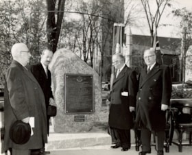 Photograhs of Lavy Becker, Sam Bronfman and two others at the new memorial to Ezekiel Hart during unveiling ceremony at Three Rivers Cemetery (#225); and Rabbi Frank looking at the Menorah in the main sanctuary (#235).