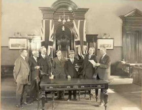 David Epstein being sworn in as a member of the Court of Revision by city clerk N.H.H. Lett in the council chamber of City Hall, Ottawa.
