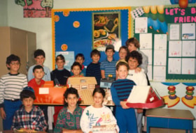 Hillel Academy class pose with models of Noah's Arc.