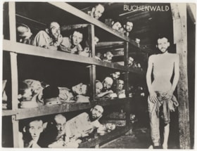 Elie Wiesel and newly liberated prisoners in their barrack
