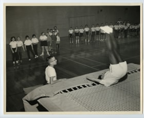 Hillel Academy students wait their turn to use the trampoline during gym class.